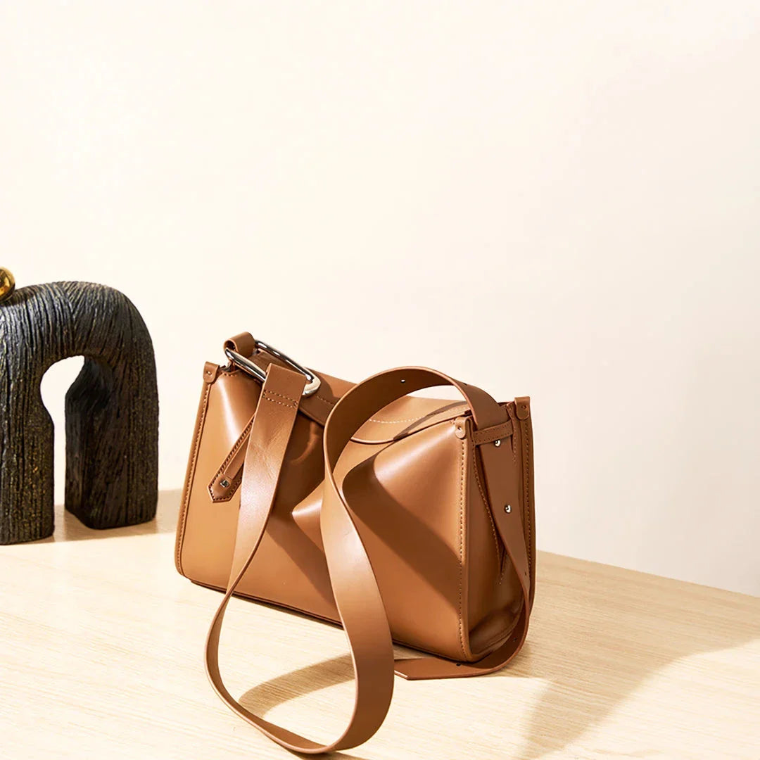 Genuine leather shoulder bag with soft, pillow-like shape and secure zipper closure