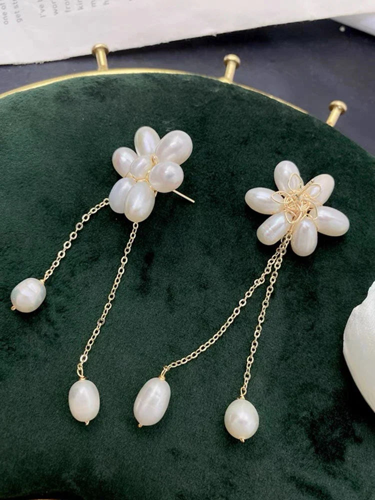 Elegant freshwater pearl necklace with intricate butterfly, dragonfly, and insect-inspired design on a copper-plated 14K gold chain