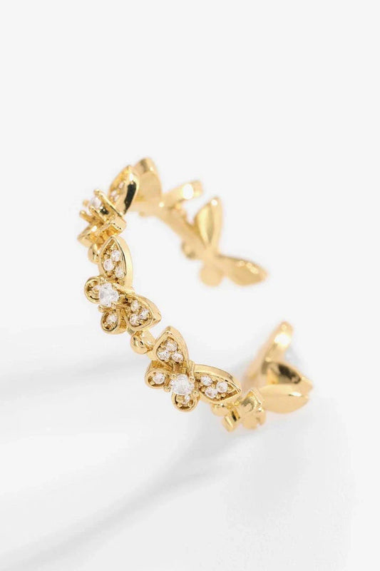 Elegant gold-toned open ring with a captivating butterfly design accented by sparkling zircon stones