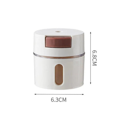 A modern, wall-mounted glass salt dispenser with magnetic suction and precise quantitative control for effortless kitchen organisation.