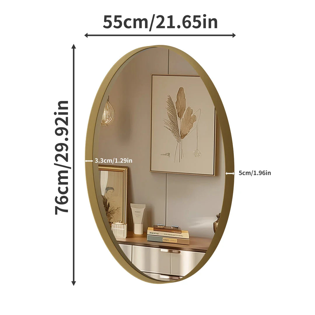 Elegant oval gold wall mirror with a contemporary decorative brushed gold frame
