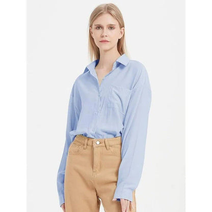 A classic long-sleeve button-up blouse in a range of chic colours, offering timeless elegance and modern sophistication for the fashion-conscious woman.