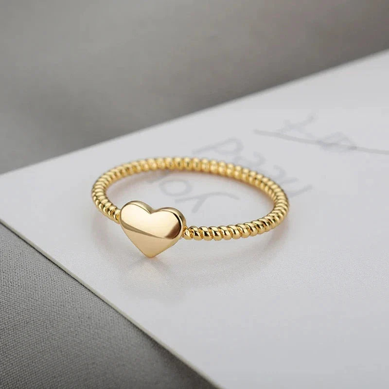 Elegant heart-shaped love ring in stainless steel and copper, a timeless and versatile piece of bridal jewellery