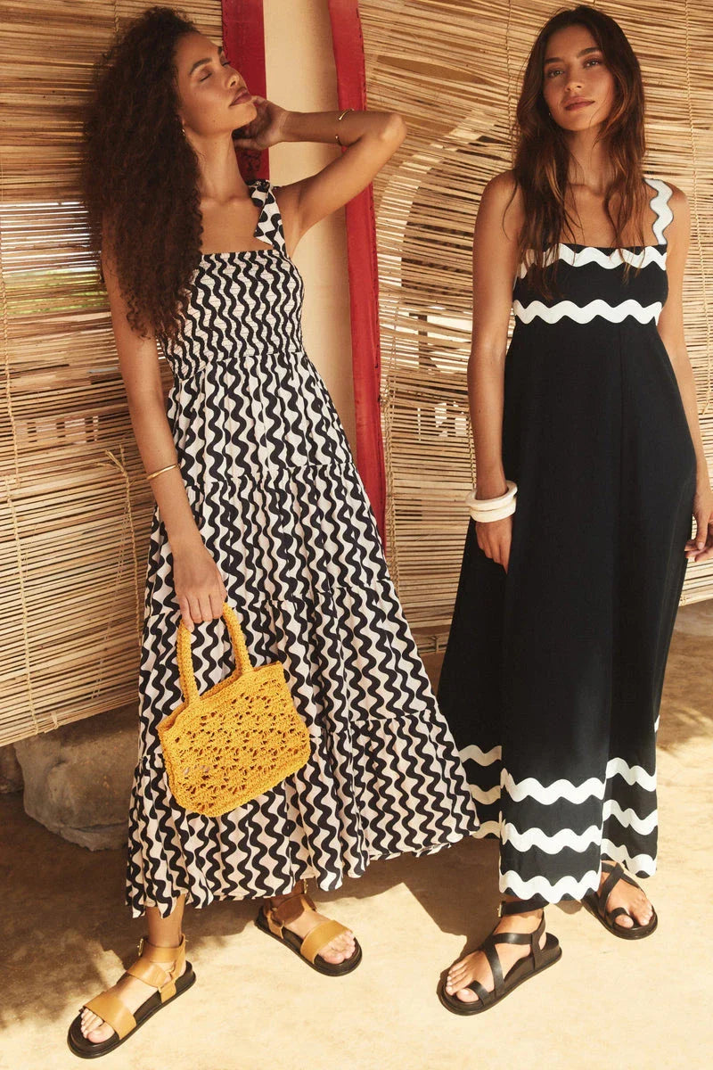 Elegant floral print suspender midi dress in black, perfect for summer beach holidays in the UK