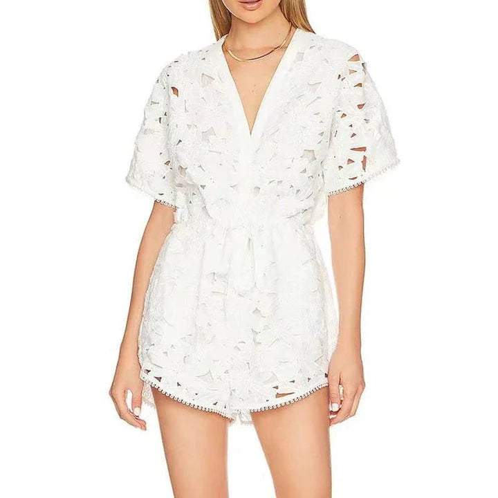 Elegant embroidered playsuit with hollow-out details, perfect for British summer style