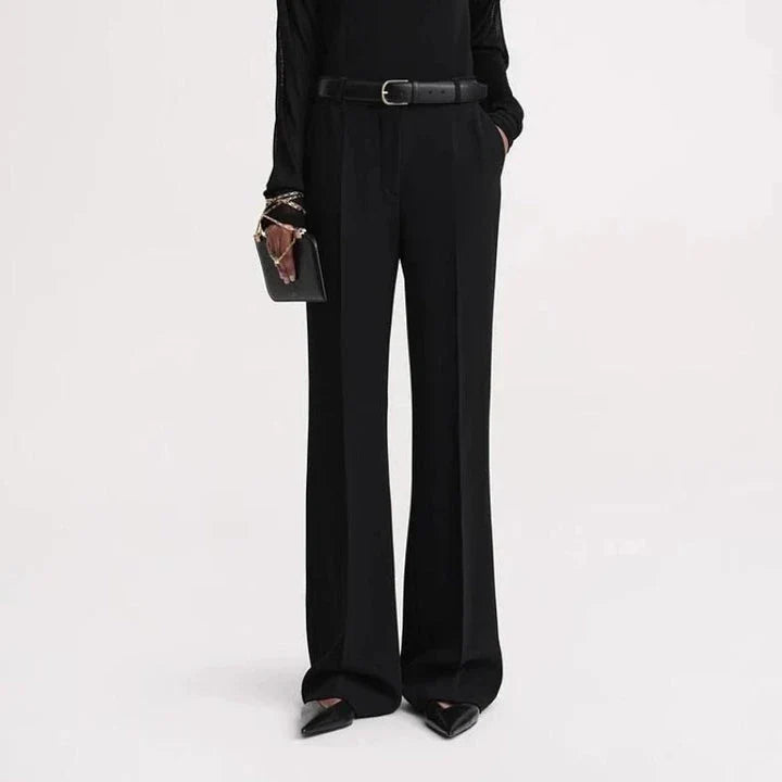 Elegant high-waist flared trousers for women in a solid pattern with a flattering fit and subtle pocket details