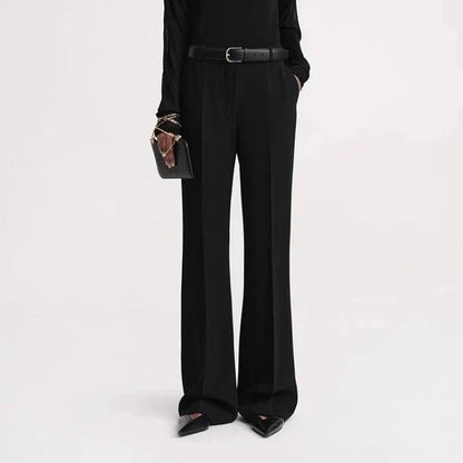 Elegant high-waist flared trousers for women in a solid pattern with a flattering fit and subtle pocket details