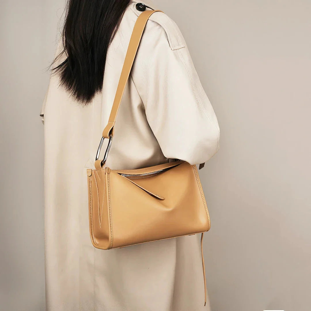 Genuine leather shoulder bag with soft, pillow-like shape and secure zipper closure
