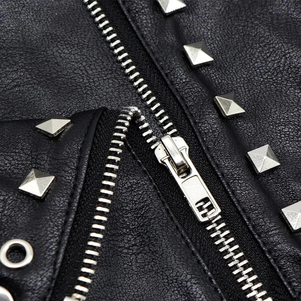 A black leather jacket designed for cats, featuring a sleek and stylish look to elevate your feline's fashion sense.