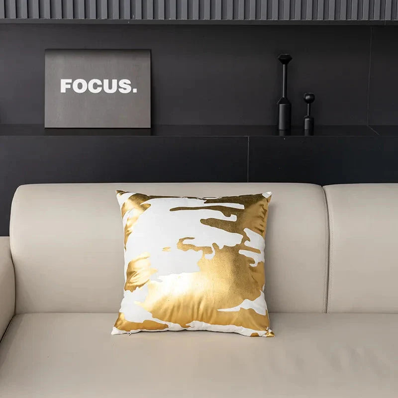Pair of Nordic-inspired geometric plush pillowcases with a luxurious gold pattern on a white and black background