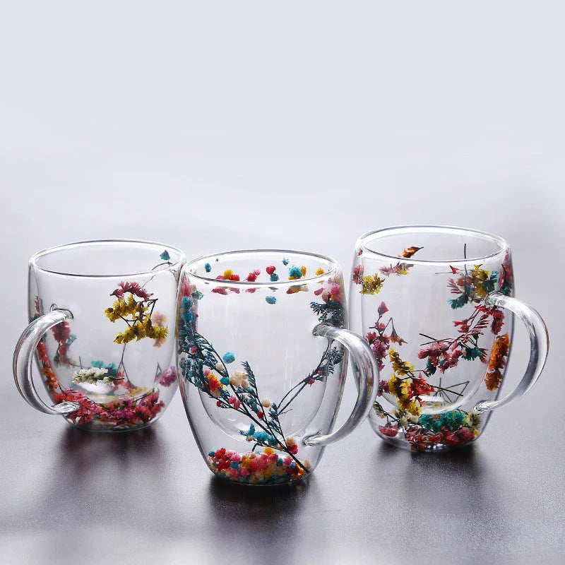 Elegant double-walled glass tea mug with a captivating floral design, ideal for hot and cold beverages
