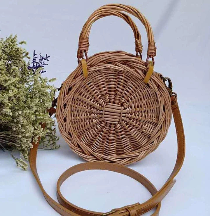 Charming floral hanging basket made of premium rattan, featuring a delicate flower pattern and versatile design for indoor or outdoor use.