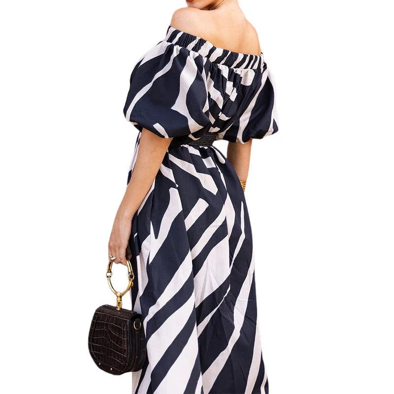 Elegant floral-print off-shoulder midi dress in black, showcasing a feminine A-line silhouette and premium polyester construction