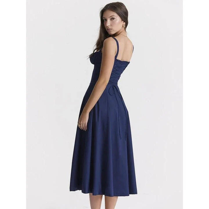 Elegant backless midi sundress in blue, featuring a stylish high split and mid-calf length for a sophisticated summer look.