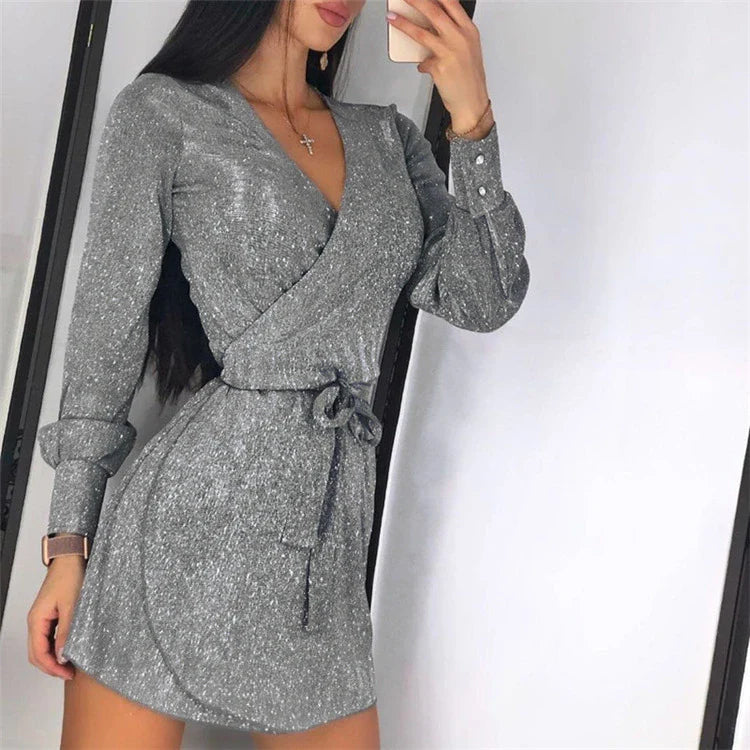 A glamorous midi dress with a lace overlay and sparkling silver sequin details, perfect for special occasions.