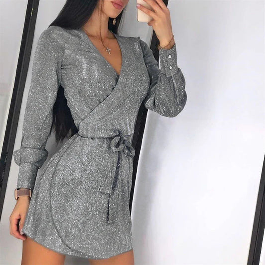 A glamorous midi dress with a lace overlay and sparkling silver sequin details, perfect for special occasions.