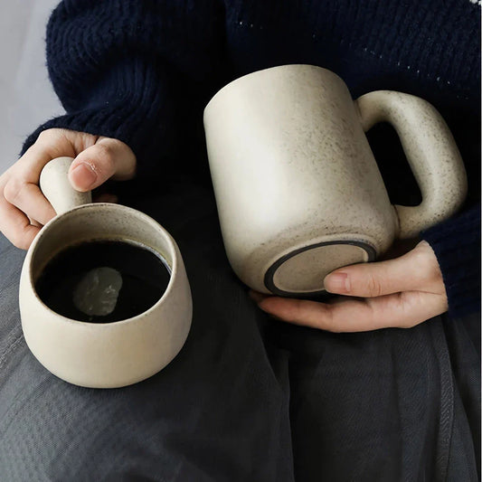 Elegant Japanese stoneware retro coffee mug in solid apricot and grey colours with comfortable handgrip shape