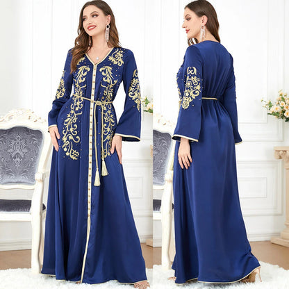 A sophisticated long-sleeve women's dress with a captivating floral embroidery pattern and a refined colour palette, suitable for a variety of occasions.