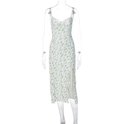 Elegant floral midi dress with slit, adjustable suspender straps, and luxurious polyester fabric for a sophisticated summer look.