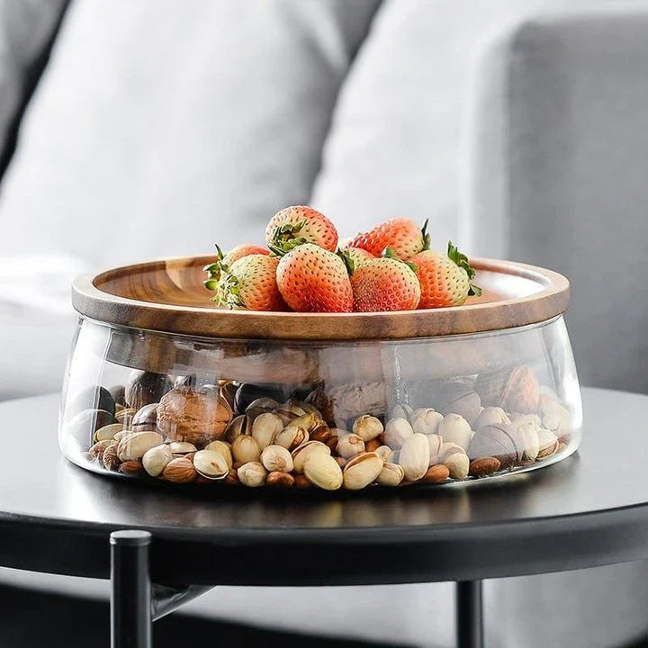 A transparent glass storage canister with a wooden lid, offering elegant and functional kitchen storage