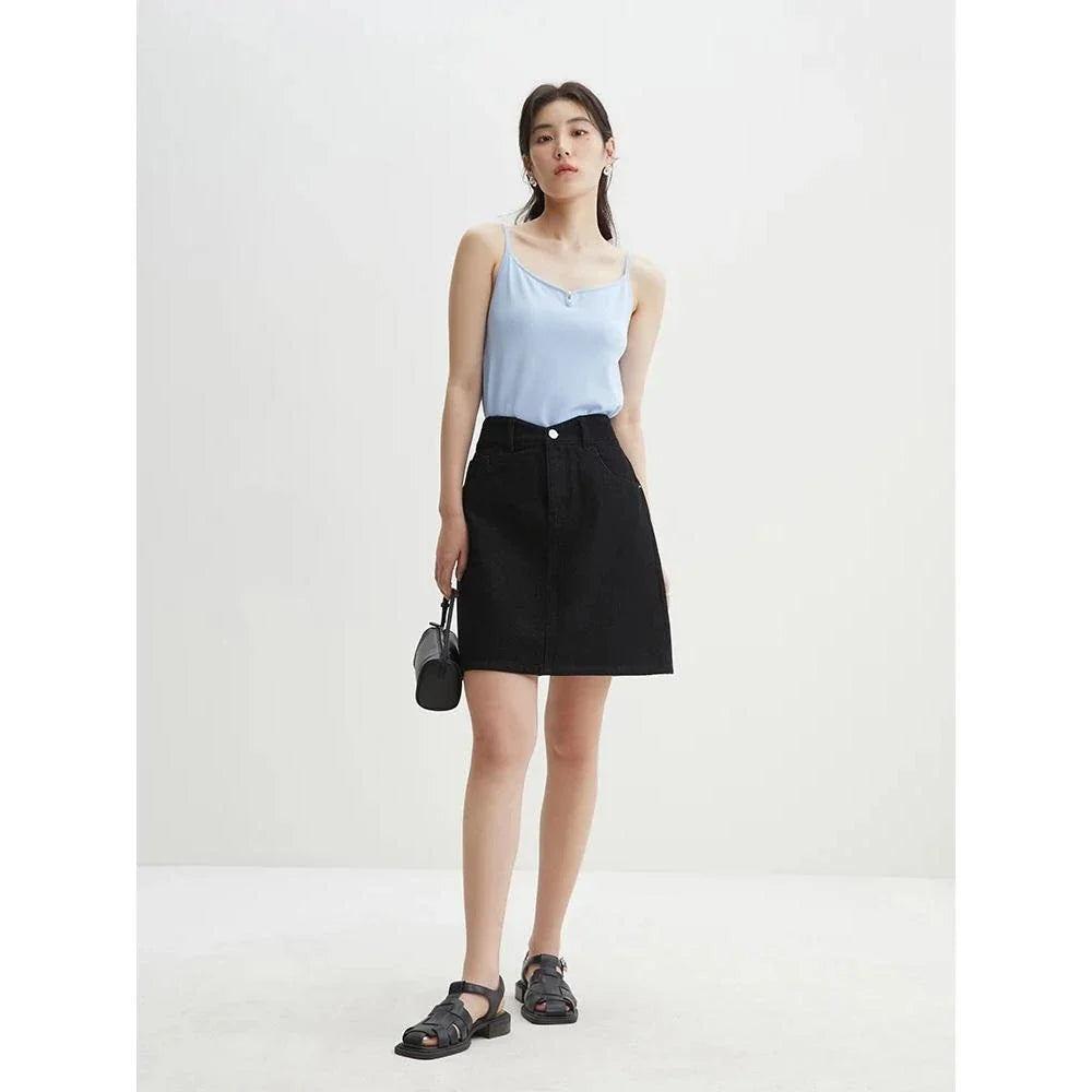 Chic high-waisted denim skirt in a classic blue shade, featuring an A-line silhouette and a flattering empire waistline.