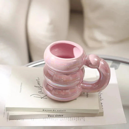 Charming ceramic coffee mug with a circular bubble design in a light blue colour, perfect for morning beverages in the UK