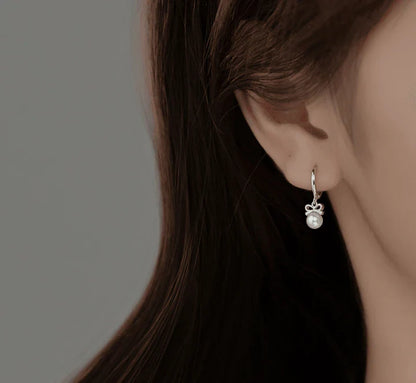Elegant sterling silver earrings with a delicate butterfly design, inspired by Japanese and Korean fashion