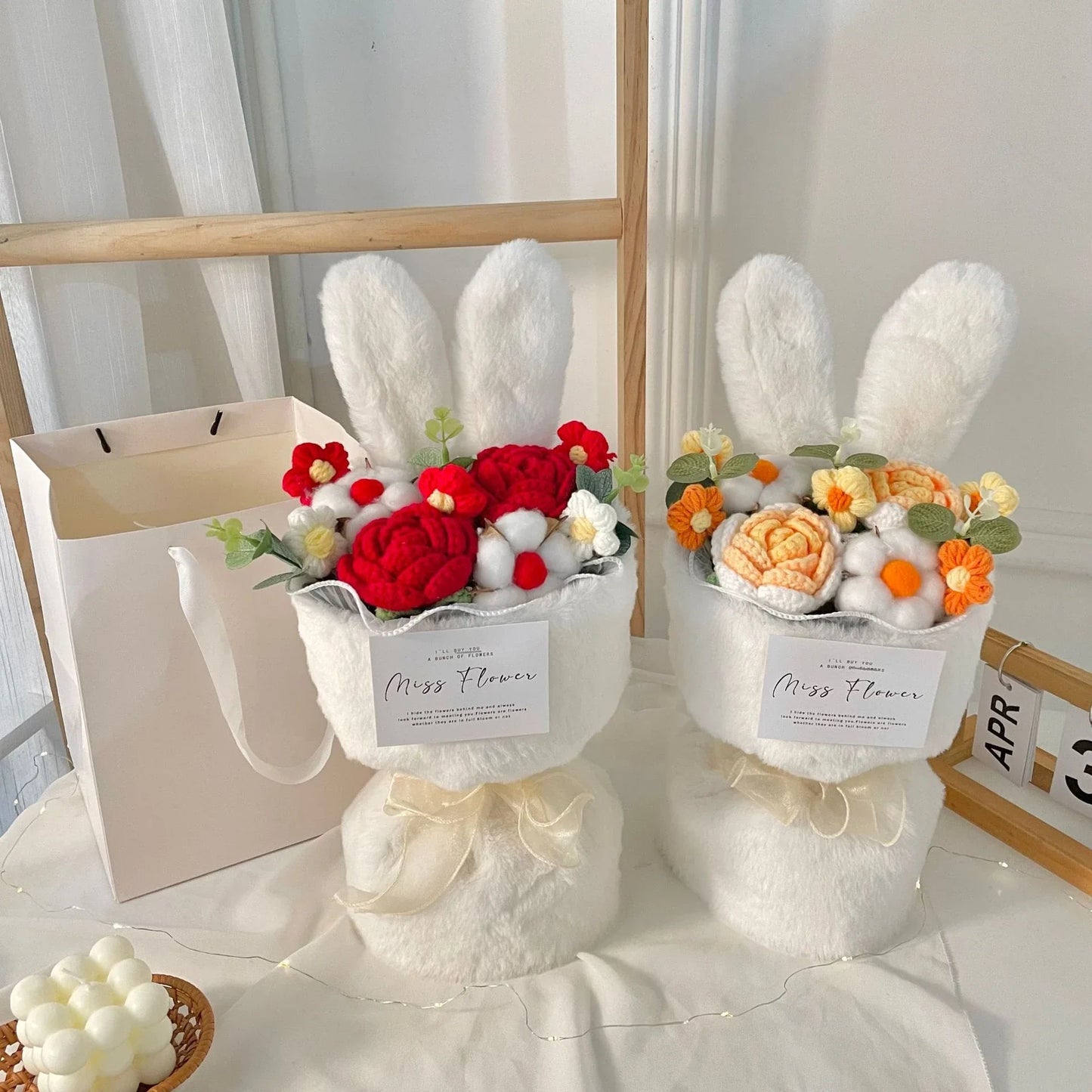 A delightful knitted rabbit bouquet doll in vibrant colours, featuring soft plush materials and a charming design