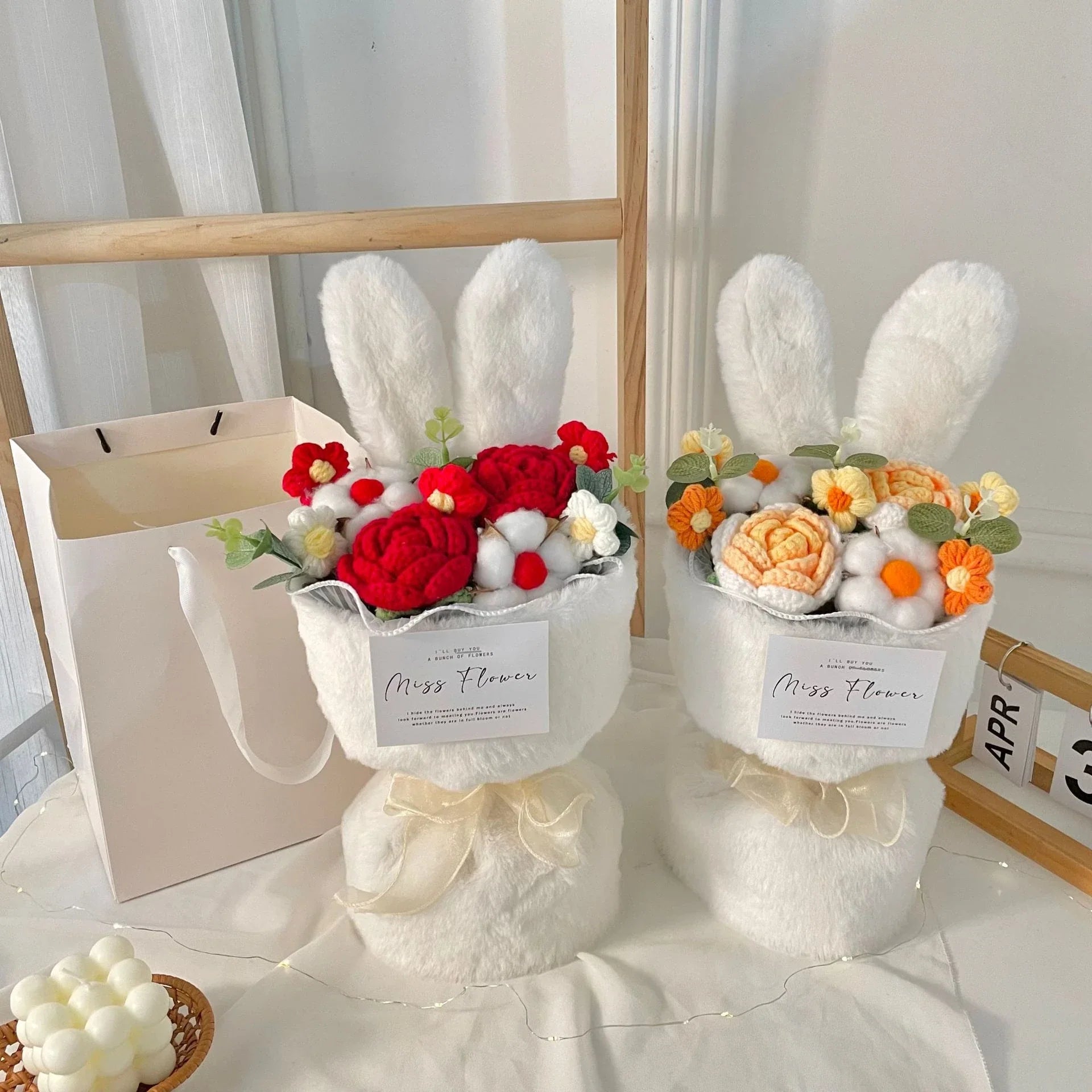 A delightful knitted rabbit bouquet doll in vibrant colours, featuring soft plush materials and a charming design