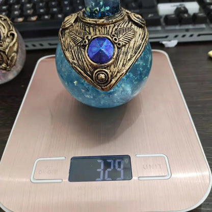 Enchanting glow-in-the-dark resin mermaid bottle with intricate design and mesmerizing moonlit display