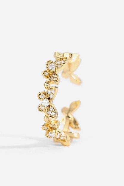 Elegant gold-toned open ring with a captivating butterfly design accented by sparkling zircon stones