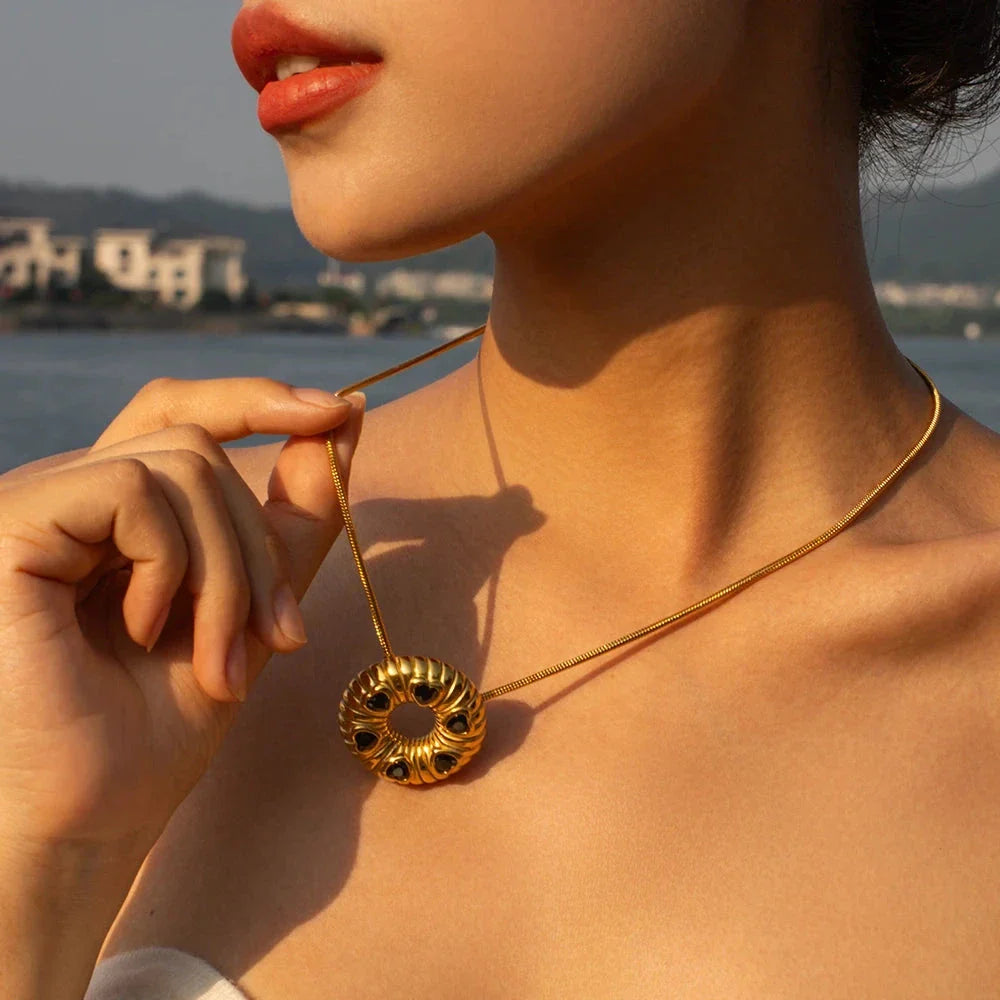 Elegant 18K gold plated minimalist jewellery set with O-shaped earrings and necklace, crafted from durable stainless steel for timeless style.