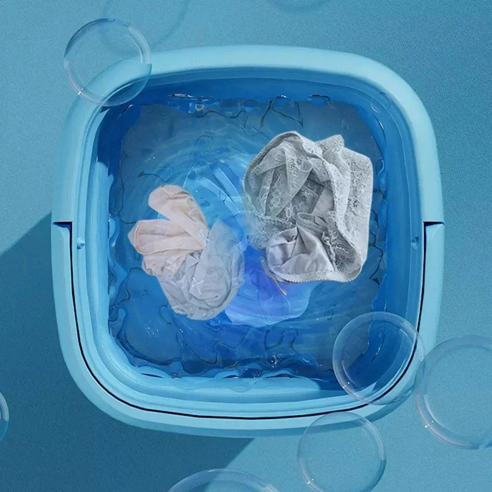 Compact and portable mini automatic washing machine with a sleek, space-saving design for small living spaces