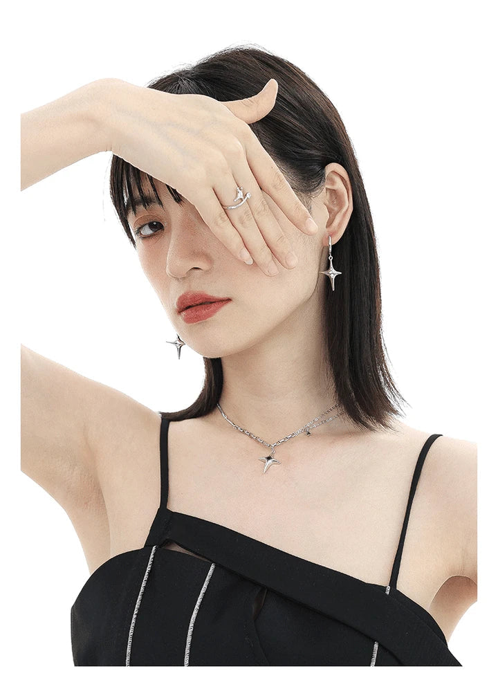 Asymmetric four-star silver needle earrings with a premium design for fashionable women