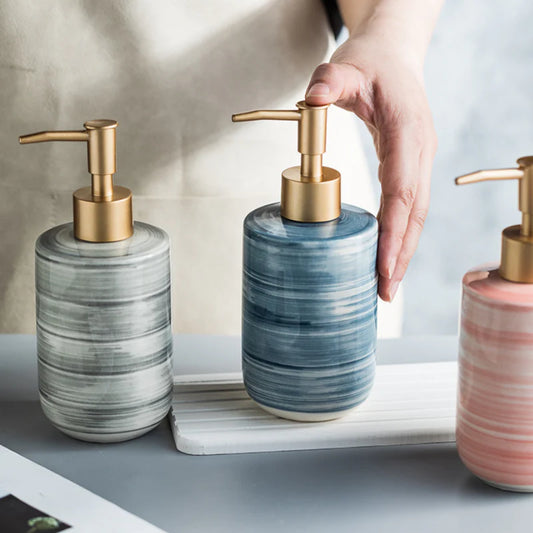Elegant Nordic-style ceramic soap dispenser set in blue, featuring a glossy finish and sturdy construction for practical bathroom or kitchen use.