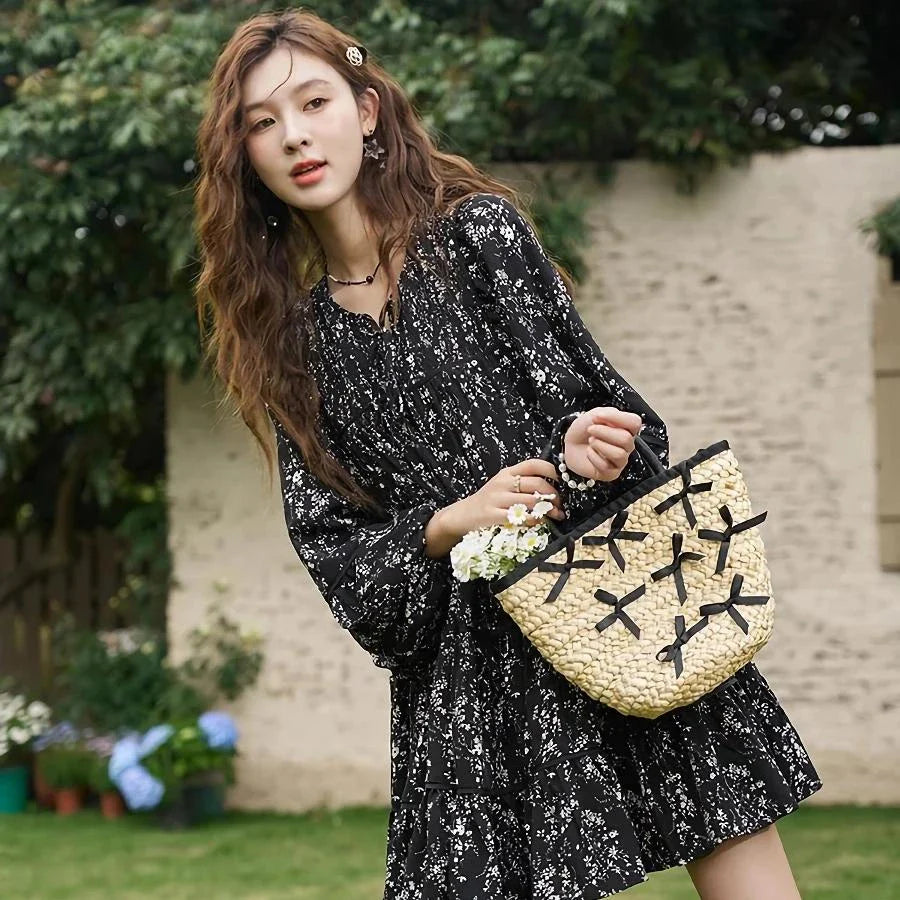 Elegant floral print dress with flared sleeves and flounced edges, perfect for middle-aged women who appreciate style and comfort.