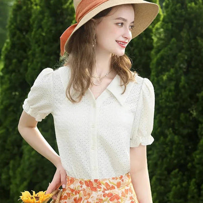 Elegant apricot French-inspired lace blouse with puff sleeves and v-neck collar, perfect for the modern British woman