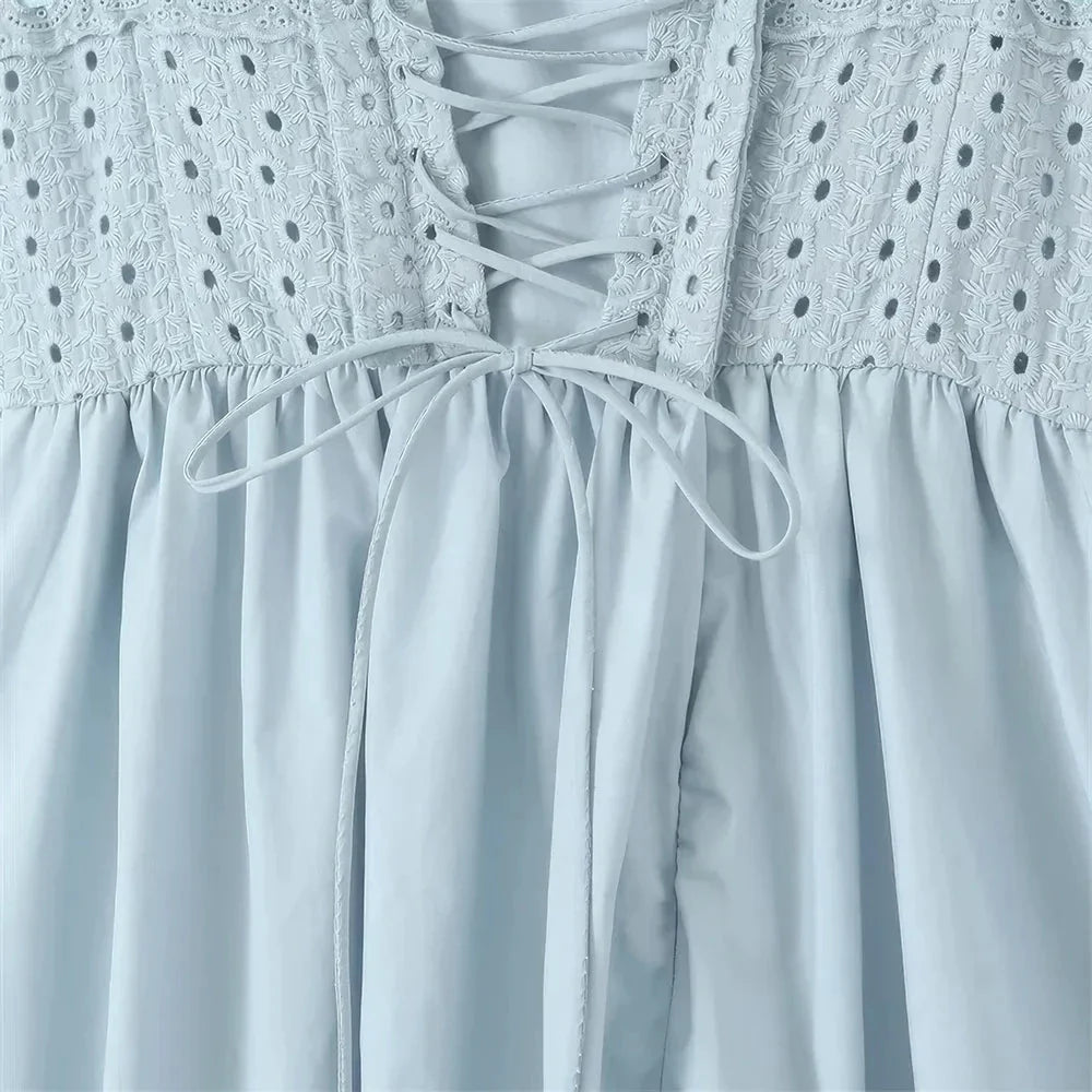 Blue midi crochet dress with spaghetti straps, bustier design, and floral crochet pattern