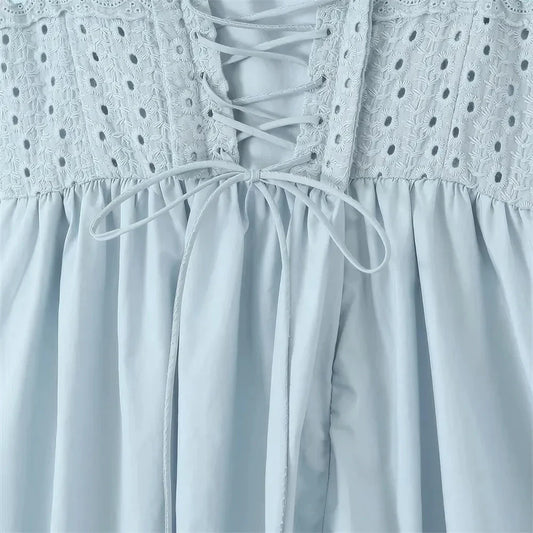 Blue midi crochet dress with spaghetti straps, bustier design, and floral crochet pattern