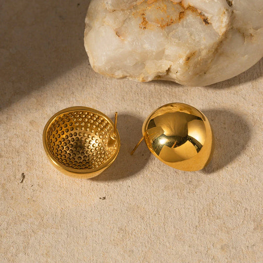 A pair of stylish, 18K gold-plated hemispherical cutout earrings with a sleek, sophisticated design