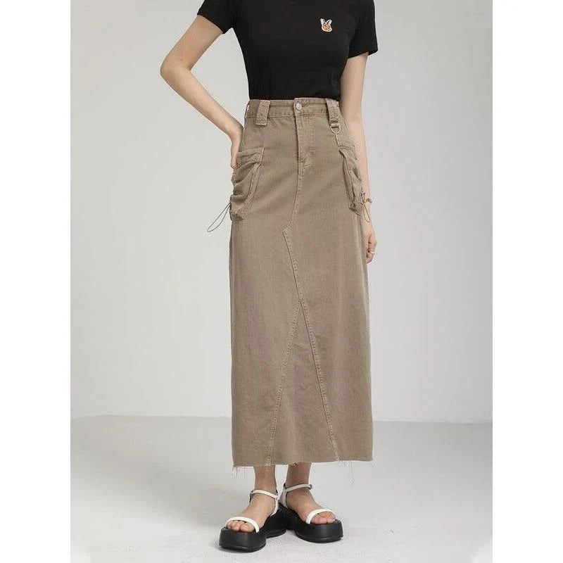 Elegant autumn vintage high-waist denim cargo skirt with pockets, featuring a flattering A-line silhouette and practical design