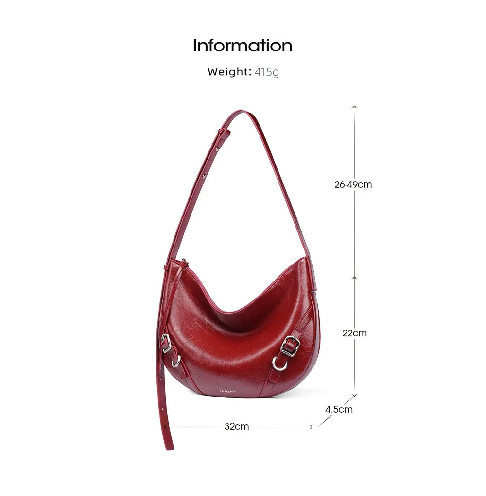 Elegant leather shoulder and crossbody bag for women, featuring a spacious main compartment, interior zip pocket, and contemporary design