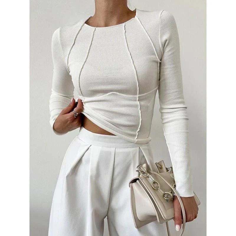 A model wearing a comfortable and stylish long sleeve t-shirt in a solid white colour.