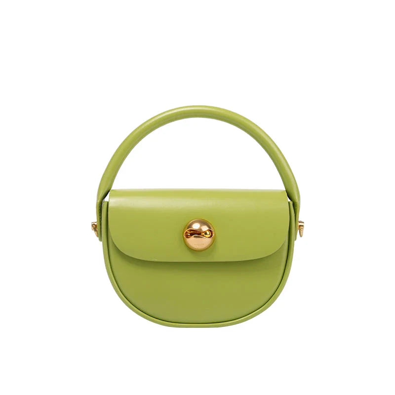 Exquisite red leather round handbag with ball-inlaid hardware, a chic and versatile accessory for UK fashion enthusiasts