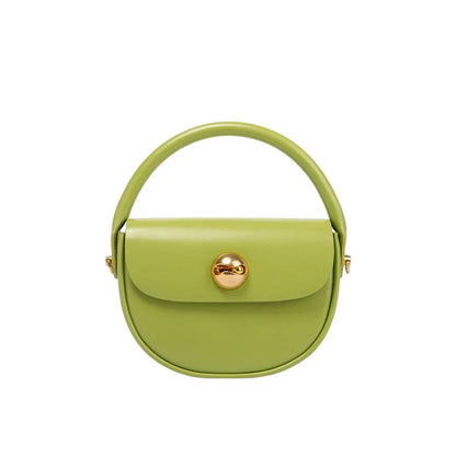 Exquisite red leather round handbag with ball-inlaid hardware, a chic and versatile accessory for UK fashion enthusiasts