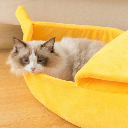 A cosy, banana-shaped cat bed made of plush, supportive materials in various vibrant colours to provide a comfortable and stylish retreat for feline friends.