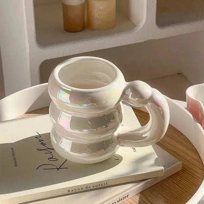 Charming ceramic coffee mug with a circular bubble design in a light blue colour, perfect for morning beverages in the UK