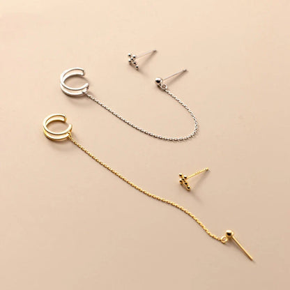 Asymmetric sterling silver one-piece earring and ear clip set with a modern and distinctive design