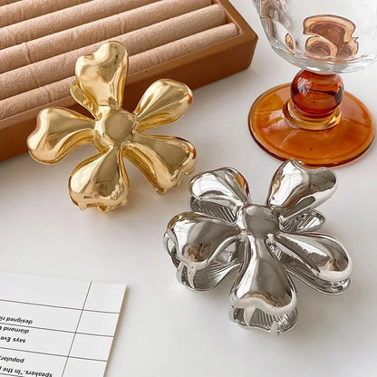 Gold floral metal hair claws - chic hair accessories for women with modern design and natural elegance
