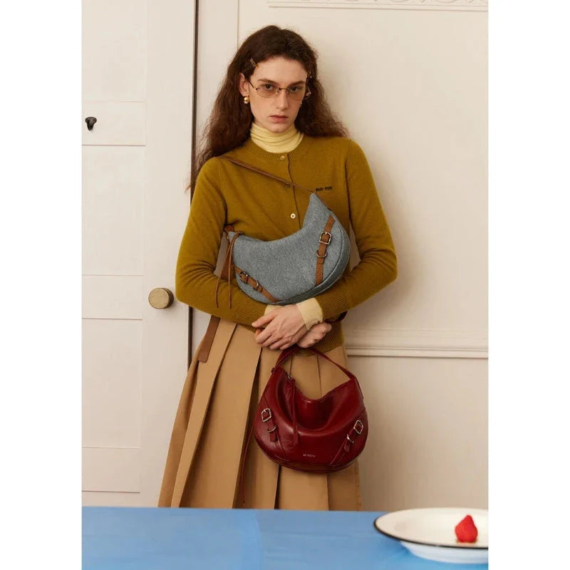 Elegant leather shoulder and crossbody bag for women, featuring a spacious main compartment, interior zip pocket, and contemporary design